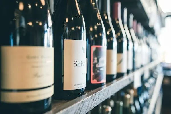 Row of wine bottles on a shelf