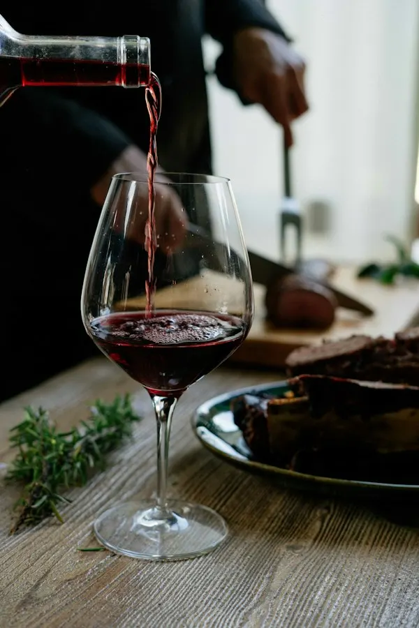 Red wine being poured into a glass